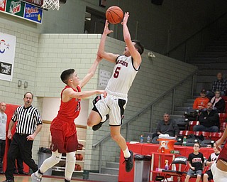 Struthers guard Andrew Carbon(5) flies towards the basket during the fourth quarter as The Struthers Wildcats takes on the Edgewood Warriors at the Struthers High School Fieldhouse in Struthers on Tuesday, Jan. 3, 2017. Struthers won, 55-45...(Nikos Frazier | The Vindicator)..
