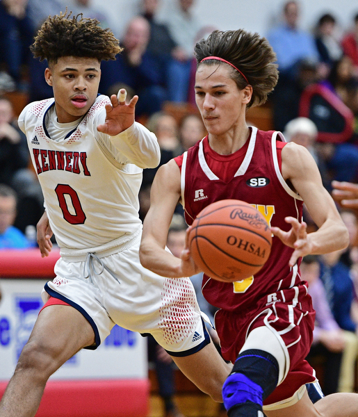WARREN, OHIO - JANUARY 3, 2017: Jay Raymer #3 of Mooney drives on Hyland Burton #0 of JFK during the first half of their game Tuesday night at John F. Kennedy High School. DAVID DERMER | THE VINDICATOR
