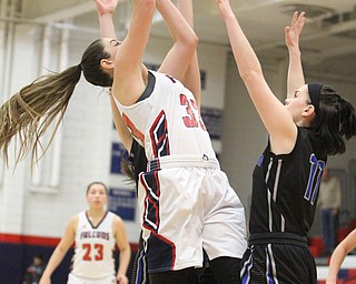 Fitch sophomore forward Sabria Hunter (33) puts up the ball while Lakeview senior Madison Meeker (11) attempts to block the shot during the third quarter as the Fitch Falcons take on the Lakeview Bulldogs at the Austintown Fitch High School Gymnasium  in Austintown on Wednesday, Jan. 4, 2017. Lakeview won, 44-36...(Nikos Frazier | The Vindicator)..
