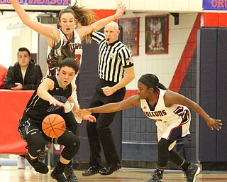 Lakeview junior Annie Pavlansky (10) falls to the ground after bouncing off of Fitch sophomore forward Sabria Hunter (33) as Fitch sophomore guard Jada Lazaro reaches for the loose ball during the third quarter as the Fitch Falcons take on the Lakeview Bulldogs at the Austintown Fitch High School Gymnasium  in Austintown on Wednesday, Jan. 4, 2017. Lakeview won, 44-36...(Nikos Frazier | The Vindicator)..