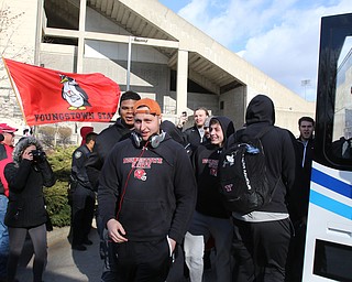       ROBERT K. YOSAY  | THE VINDICATOR..team members get high fives as they board the buses from fans and cheerleaders ..YSU Fans  gathered at Youngstown State University to  send off the Penguins to the FCS National Championship in Frisco, Texas against James Madison University. - ...- -30-...