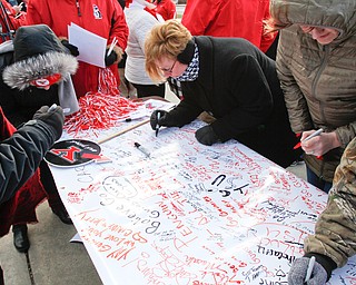        ROBERT K. YOSAY  | THE VINDICATOR..YSU fans sign a good luck banner......YSU Fans  gathered at Youngstown State University to  send off the Penguins to the FCS National Championship in Frisco, Texas against James Madison University. - ...- -30-...