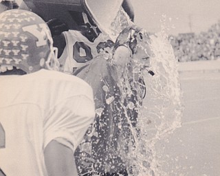 Youngstown State coach Jim Tressel is doused with water as his team defeats Marshall University to win the NCAA Div. 1-AA championship, Saturday, Dec. 18, 1993 in Huntington, WV. Youngstown State won 17-5. AP Photo Chris Dorst