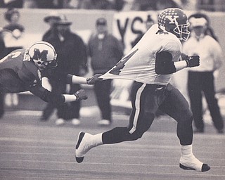 YSU'S DARNELL CLARK ELUDES MARSHALL'S TUAN REYNOLDS #6 ABD RACES MANY YARDS FOR YSU'S FIRST TOUCHDOWN. Dec. 18, 1993 Bob DeMay | The Vindicator File Photo