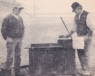 BROTHERS BOB AND JERRY RISH BRAKE THE SNOW TO COOK RIBS, CHICKEN AND KIELBOSI OUT ON STRUTHERS-COITSVILLE RD. IN COITSVILLE TWP. THE TWO WERE GETTING READY FOR A TAILGATE PARTY FOR THE YSY GAME. 10/30/1993