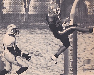 YSU DEFENSIVE BACK TERICA JONE #1 LEAPS IN FRONT OF UNIVERSITY OF IDAHO RECEIVER KEITH NEAL FOR AN INTERCEPTION IN THE THRID QUARTER TO STOP A VANDAL DRIVE. THE PENGUINS SCORED ON THEIR NEXT POSSESSION TO OUT THE GAME ON ICE. Dec. 18, 1993 Bob DeMay | The Vindicator File Photo
