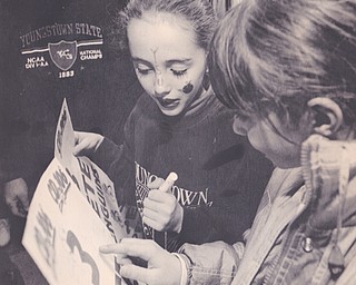 ERIN O'MALLEY(LEFT) A FIFTH GRADER FROM MCKINLEY ELEMENTARY IN POLAND CHECKS OUT HER PENGUIN AUTOGRAPHS WITH THIRD GRADER STEFANIE GRAD ALSO A STUDENT AT MCKINLEY ELEMENTARY.Dec. 17, 1994 LISA KYLE | The Vindicator File Photo