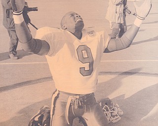 YSU DEFENSIVE BACK CHRIS JONES CELEBRATES THE PENGUINS NATIONAL CHAMPIONSHIP AT GAMES END. Dec. 17, 1994 Bob DeMay | The Vindicator File Photo