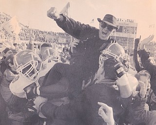 YSU SCOUT COACH PAT SPURGEON IS CARRIED FROM THE FIELD BY PENGUIN PLAYERS RAY MILLER (LEFT) AND GEORGE TOMASCH FOLLWOING THE GAME Dec. 17, 1994 Bob DeMay | The Vindicator File Photo