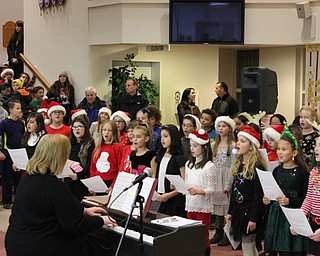 Neighbors | Abby Slanker.Hilltop Elementary School fourth-grade students, under the direction of Stephanie Summers, sang holiday carols for a large crowd at the Canfield United Methodist Church during the Rotary Club of Canfield’s annual Lighting of the Green on Dec. 2.