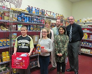 Neighbors | Alexis Bartolomucci.Students and staff from Boardman Center Intermediate School celebrated the food pantry that was .put into place on Nov. 29. Pictured are, from left, (front) Danny Enright, Lilly Snyder and Mary Scott; (back) Mindy DePietro, Assistant Principal Matt Beard and Principal Randy Ebie.