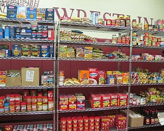Neighbors | Alexis Bartolomucci.Shelves were stocked with food items many Boardman Center Intermediate School students brought in for the food pantry.