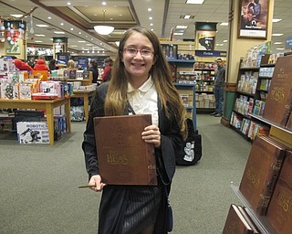 Neighbors | Alexis Bartolomucci.Keira Crouch dressed up and held the new Harry Potter book on Dec. 9 at the Boardman Barnes and Noble during the Harry Potter Holiday Ball.