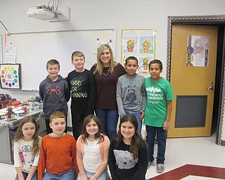 .Neighbors | Alexis Bartolomucci.Candace Monacelli stood with fourth-grade students at Robinwood Lane Elementary after speaking to them about weather on Dec. 8.