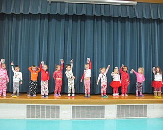 Neighbors | Alexis Bartolomucci.Joy Bucci's class raised their silver bells in the air during Polar Express Day as they prepared for their upcoming holiday sing at Poland North Preschool.