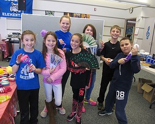 Neighbors | Alexis Bartolomucci.Fourth-grade students held up items from Santa's Workshop at Dobbins Elementary. Picture are, from left, (back) Olivia Minehart, Stella Pompeo and Yianna Hazimihalis; (front) Kylee Hudran, Grace Ayres, Kaley Johnson and Vincent Perfilio.