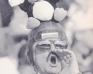 JERRY HIGHES OF NORTH LIMA, DONING HIS PENGUIN HEAD GEAR, CHEERS ON THE PENGUINS AGAINST MCNESSE STATE.  BOB DEMAY | THE VINDICATOR FILE PHOTO