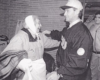JIM TRESSEL AND HIS MOM EMBRACE OUTSIDE THE LOCKER FOOM FOLLOWING THE GAME. BOB DEMAY | THE VINDICATOR FILE PHOTO