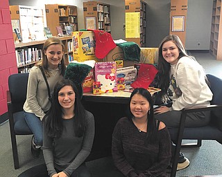 SPECIAL TO THE VINDICATOR
Canfield students make stockings for Beatitude House
Interact and Art Club of Canfield High School recently completed a service project to benefit the Beatitude House of Youngstown. The Art Club made 40 stockings for the women and children at Beatitude House and the Interact Club filled the stockings with treats. Sister Mary Alice Koval of Beatitude House received the donations. Some of those participating in the project were Ella Mitchell, left, Joanna Kilka, Remi Mikan and Marina Jones.