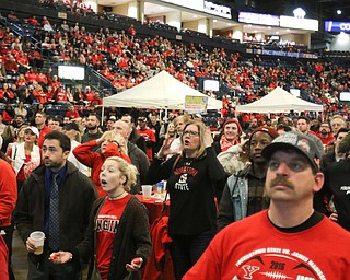        ROBERT K. YOSAY  | THE VINDICATOR..Solemn faces...a near capacity crowd watched as YSU battled James Madison for the Championship- finally falling behind before the half and never caught up- ..