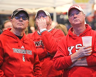        ROBERT K. YOSAY  | THE VINDICATOR..Long second half as Tom Keller of Austintown  Cole Pentz of Youngstown ( and  former center for YSU) Dutch Crittenden of Austintown.. watch the game..a near capacity crowd watched as YSU battled James Madison for the Championship- finally falling behind before the half and never caught up- ..