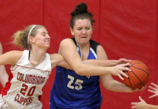 William D. Lewis The Vindicator  Columbiana's Alexis Cross(20)and past Lisbon's Maddie Liberati(25) go for the ball duringJan. 9, 2017 action at Columbiana.