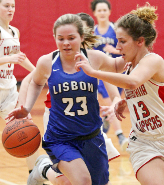 William D. Lewis The Vindicator Lisbon's Abby Davis(23) drives around Columbiana's Mariah Rovnak(23) during Jan. 9, 2017 action at Columbiana.