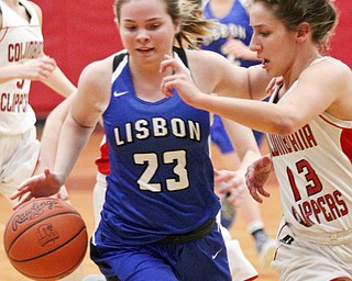 William D. Lewis The Vindicator Lisbon's Abby Davis(23) drives around Columbiana's Mariah Rovnak(23) during Jan. 9, 2017 action at Columbiana.