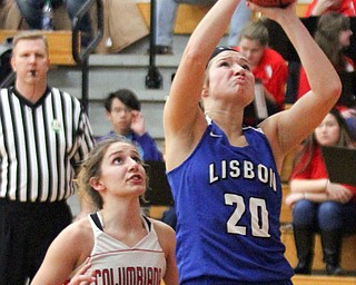 William D. Lewis The Vindicator  Lisbon's Autumn Oehlstrom(20) shoots past Columbiana' Mariah Rovnak(13)during jan. 9, 2017 action at Columbiana.