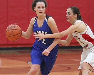 William D. Lewis The Vindicator Lisbon's Karlee Pezzano(2) drives around Columbiana's Kayla Muslovski(4) during Jan. 9, 2017 action at Columbiana.