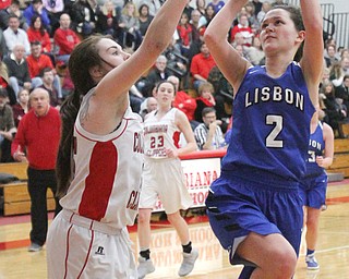 William D. Lewis The Vindicator Lisbon's Karlee Pezzano(2) drives around Columbiana's Kennedy fullum(15) during Jan. 9, 2017 action at Columbiana.
