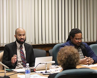 Boardmembers Dario Hunter(left) and Ronald Shadd argue about school board president and Shadd's mother, Brenda Kimble during the reorganizational meeting at the Youngstown City School Board of Education in Youngstown on Tuesday, Jan. 10, 2017. ..(Nikos Frazier | The Vindicator).
