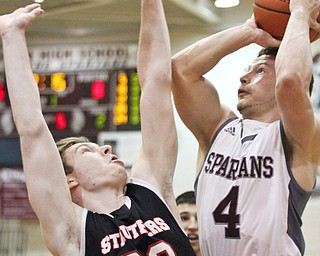 William D. Lewis The Vindicator Boardman's Mike Melewski94) shoots over StruthersRyan Leonard(20) during Jan. 10 action at Boardman.