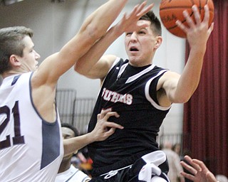 William D. Lewis The Vindicator Struthers Andrew Carbon(5) shoots past Boardman's Sebastian Heinonen(21) during Jan. 10 action at Boardman.