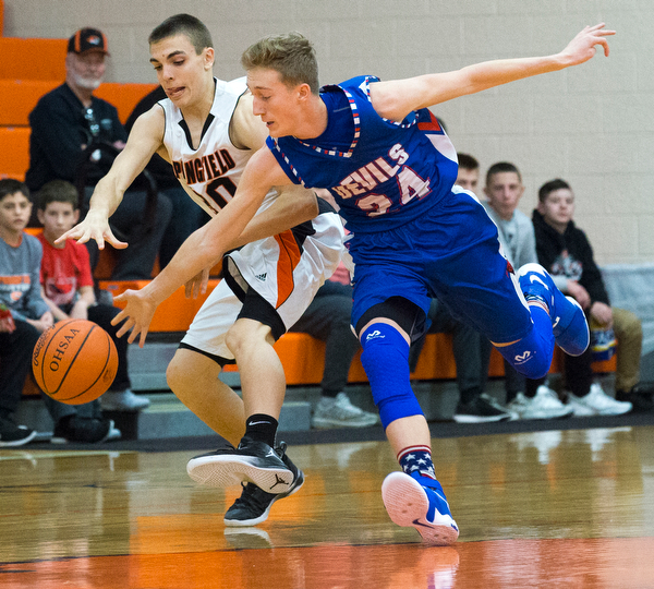MICHAEL G TAYLOR | THE VINDICATOR- 01-10-17 -  Basketball -1st qtr, Reserve's #24 Kade Hilles steals the ball from Springfield's #30 Jake Ford. Western Reserve Blue Devils vs Springfield Tigers at New Middletown Springfield High School in New Middletown Springfield, OH.