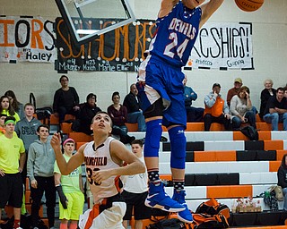 MICHAEL G TAYLOR | THE VINDICATOR- 01-10-17 -  Basketball -1st qtr, Reserve's #24 Kade Hilles slams the ball against Springfield's #30 Jake Ford. Western Reserve Blue Devils vs Springfield Tigers at New Middletown Springfield High School in New Middletown Springfield, OH