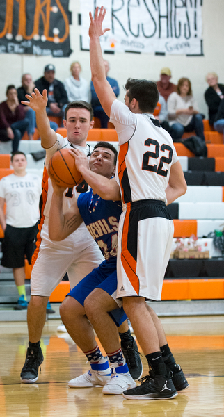 MICHAEL G TAYLOR | THE VINDICATOR- 01-10-17 -  Basketball -1st qtr, Reserve's #34 Jack Cappabianca is defended by Springfield's #14 Zack Barber and #22 Pat Flara. Western Reserve Blue Devils vs Springfield Tigers at New Middletown Springfield High School in New Middletown Springfield, OH