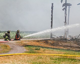        ROBERT K. YOSAY  | THE VINDICATOR... a barn fire in poland township - on Struthers Road completely destroyed the barn and hay and equipment inside...- the fire of unknown cause was fought by many area firefighters as grass fires from the fire also spread. - -30-...