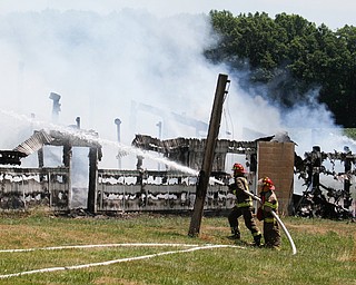        ROBERT K. YOSAY  | THE VINDICATOR... a barn fire in poland township - on Struthers Road completely destroyed the barn and hay and equipment inside...- the fire of unknown cause was fought by many area firefighters as grass fires from the fire also spread. - -30-...