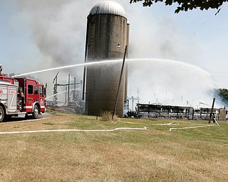        ROBERT K. YOSAY  | THE VINDICATOR... a barn fire in poland township - on Struthers Road completely destroyed the barn and hay and equipment inside...- the fire of unknown cause was fought by many area firefighters as grass fires from the fire also spread. - -30-...