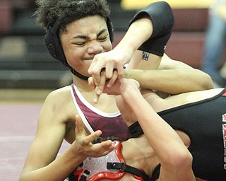 Canfield 106 pound wrestler Chris Makara(Black) is pinned in a headlock by Boardman 106 pound wrestler Nicholas Esmail(red) as Boardman High School Takes on Canfield High School at the Boardman High School Gymnasium  in Boardman on Wednesday, Jan. 11, 2017. ..(Nikos Frazier | The Vindicator)..
