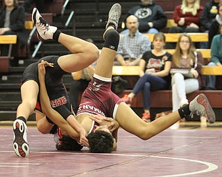 Canfield 106 pound wrestler Chris Makara(Black) is flipped over by Boardman 106 pound wrestler Nicholas Esmail(red) as Boardman High School Takes on Canfield High School at the Boardman High School Gymnasium  in Boardman on Wednesday, Jan. 11, 2017. ..(Nikos Frazier | The Vindicator)..