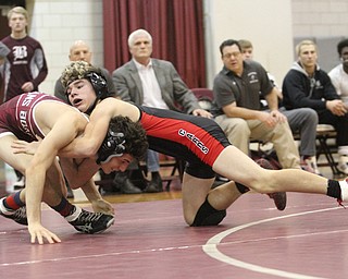 Canfield 120 pound wrestler McCoy Watkins(Black) fights to take down Boardman 120 pound wrestler Derek Slipkovich(red) as Boardman High School Takes on Canfield High School at the Boardman High School Gymnasium  in Boardman on Wednesday, Jan. 11, 2017. ..(Nikos Frazier | The Vindicator)..