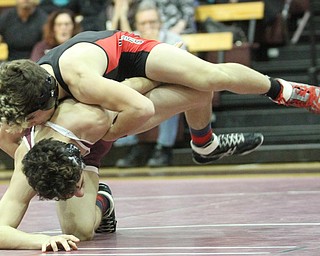 Canfield 120 pound wrestler McCoy Watkins(Black) fights to maintain control of Boardman 120 pound wrestler Derek Slipkovich(red)as Boardman High School Takes on Canfield High School at the Boardman High School Gymnasium  in Boardman on Wednesday, Jan. 11, 2017. ..(Nikos Frazier | The Vindicator)..
