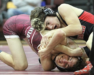 Canfield 120 pound wrestler McCoy Watkins(Black) fights to maintain control of Boardman 120 pound wrestler Derek Slipkovich(red)as Boardman High School Takes on Canfield High School at the Boardman High School Gymnasium  in Boardman on Wednesday, Jan. 11, 2017. ..(Nikos Frazier | The Vindicator)..