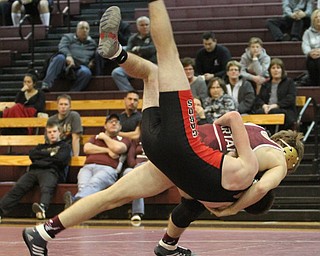 Canfield 138 pound wrestler Giovanni Dunlap(Black) is slammed to the mat by Boardman 138 pound wrestler John Fleet(red)as Boardman High School Takes on Canfield High School at the Boardman High School Gymnasium  in Boardman on Wednesday, Jan. 11, 2017. ..(Nikos Frazier | The Vindicator)..