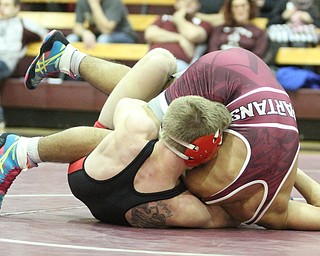 Canfield 145 pound wrestler Tanor English(Black) keeps.Boardman 145 pound wrestler Brandon Zigotti(red) in a headlock as Boardman High School Takes on Canfield High School at the Boardman High School Gymnasium  in Boardman on Wednesday, Jan. 11, 2017. ..(Nikos Frazier | The Vindicator)..