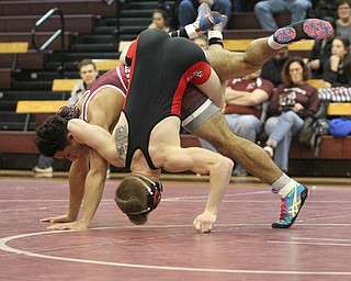 Canfield 145 pound wrestler Tanor English(Black) fights to stay attached to Boardman 145 pound wrestler Brandon Zigotti(red)as Boardman High School Takes on Canfield High School at the Boardman High School Gymnasium  in Boardman on Wednesday, Jan. 11, 2017. ..(Nikos Frazier | The Vindicator)..