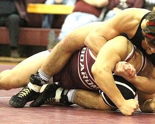Canfield 160 pound wrestler Georgio Poullas(Black) keeps .Boardman 160 pound wrestler Kareem Hamdan(red) in a headlock as Boardman High School Takes on Canfield High School at the Boardman High School Gymnasium  in Boardman on Wednesday, Jan. 11, 2017. ..(Nikos Frazier | The Vindicator)..