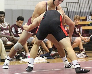 Boardman 170 pound wrestler Michael O'Horo(red)  attempts to keep Canfield 170 pound wrestler Nick Crawford(Black) in a headlock as Boardman High School Takes on Canfield High School at the Boardman High School Gymnasium  in Boardman on Wednesday, Jan. 11, 2017. ..(Nikos Frazier | The Vindicator)..